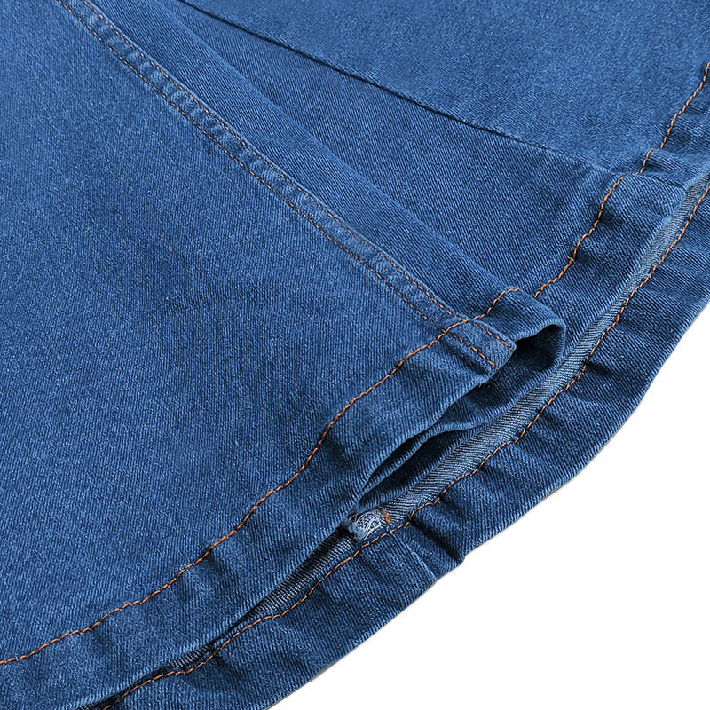 Close-up of blue denim fabric with stitching details