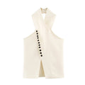 An off-white sleeveless vest with a halter-style crossover neck and a vertical row of black buttons on the front, displayed against a solid white background.