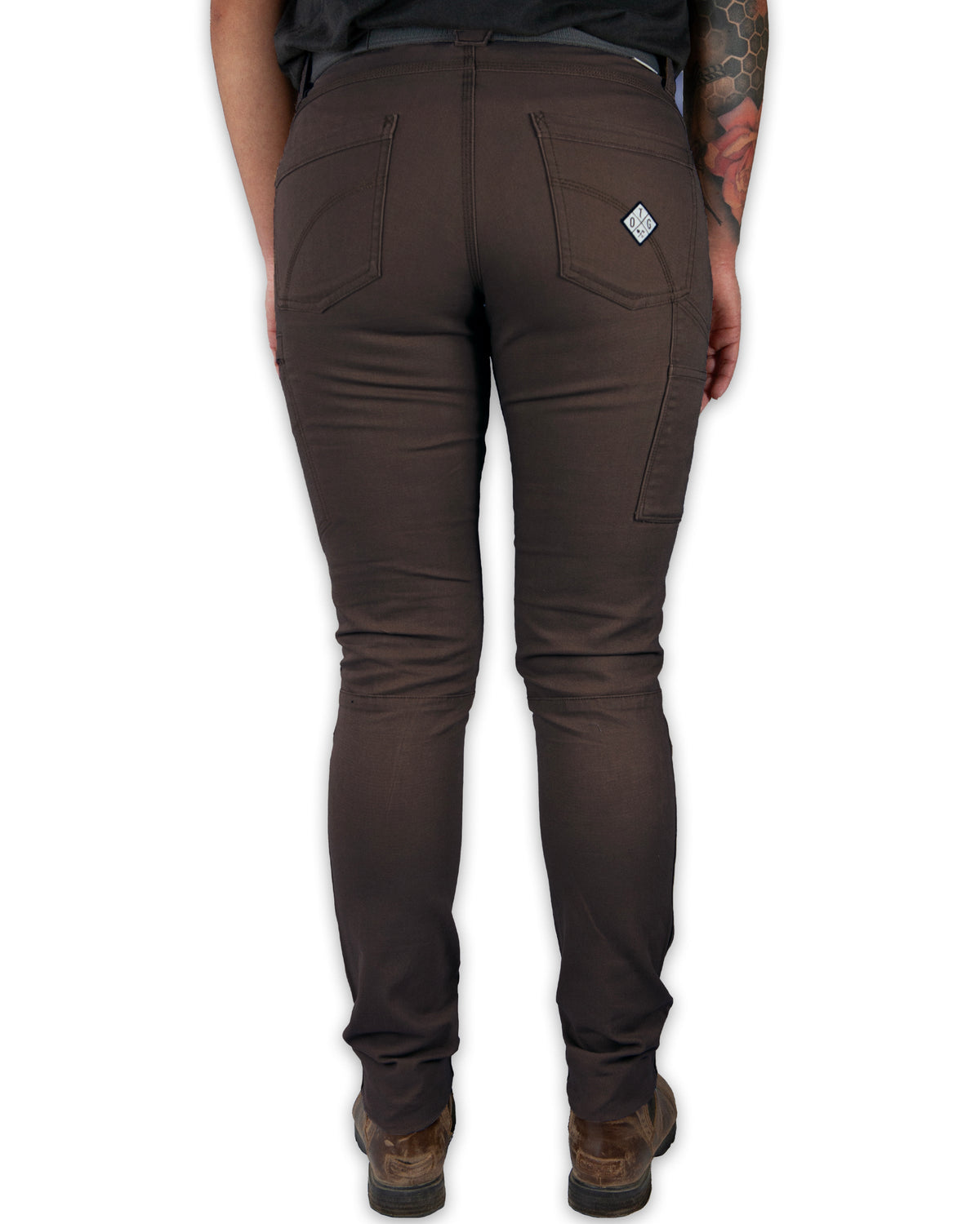 Brown pants worn by a person on a white background