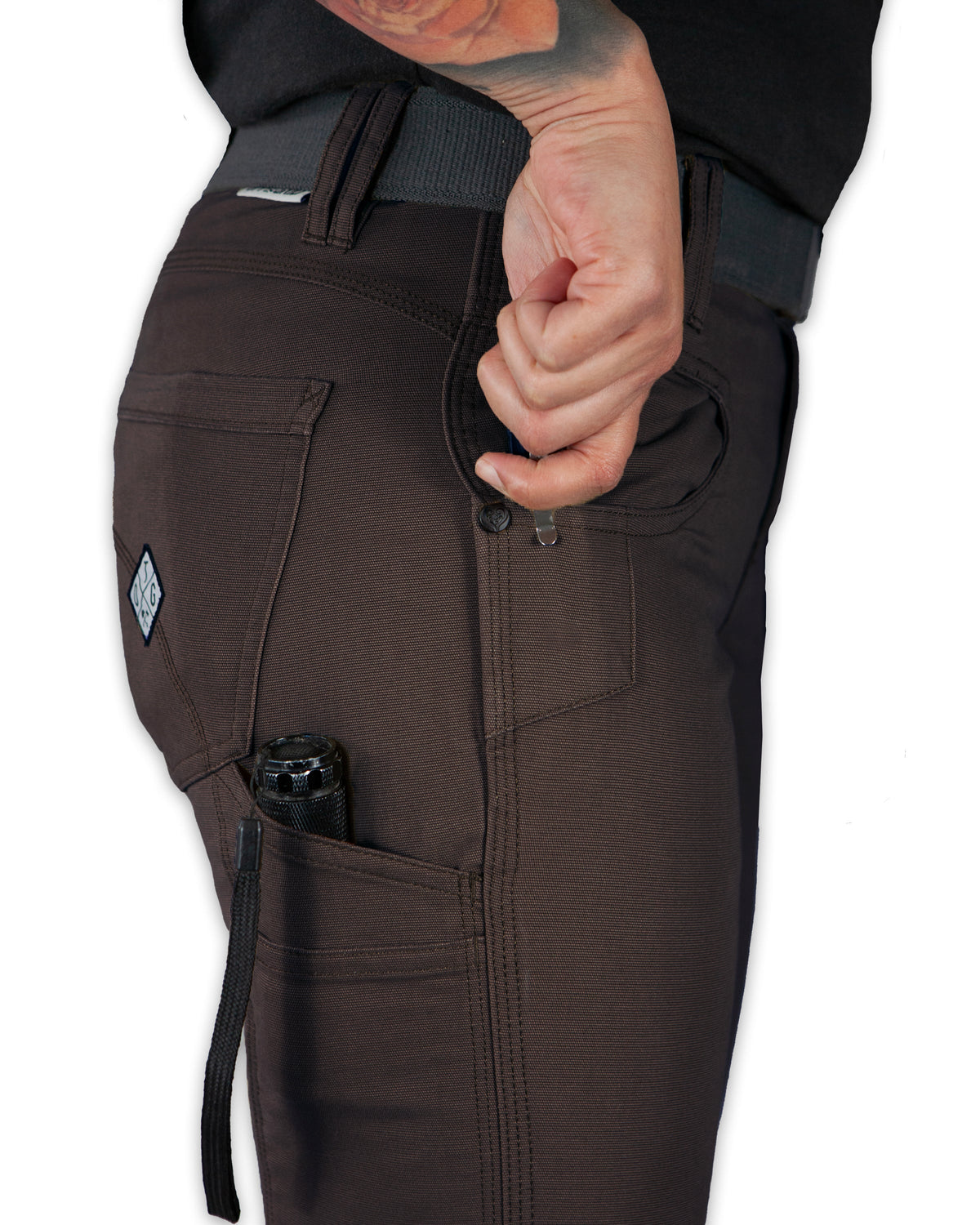 Brown tactical pants with a visible brand logo on a white background
